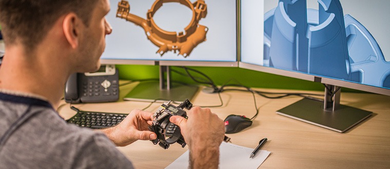 Structural engineer reviewing building design plans on digital screen