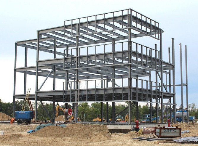 Steel structure building frame under construction showing beams and columns for durable structural design