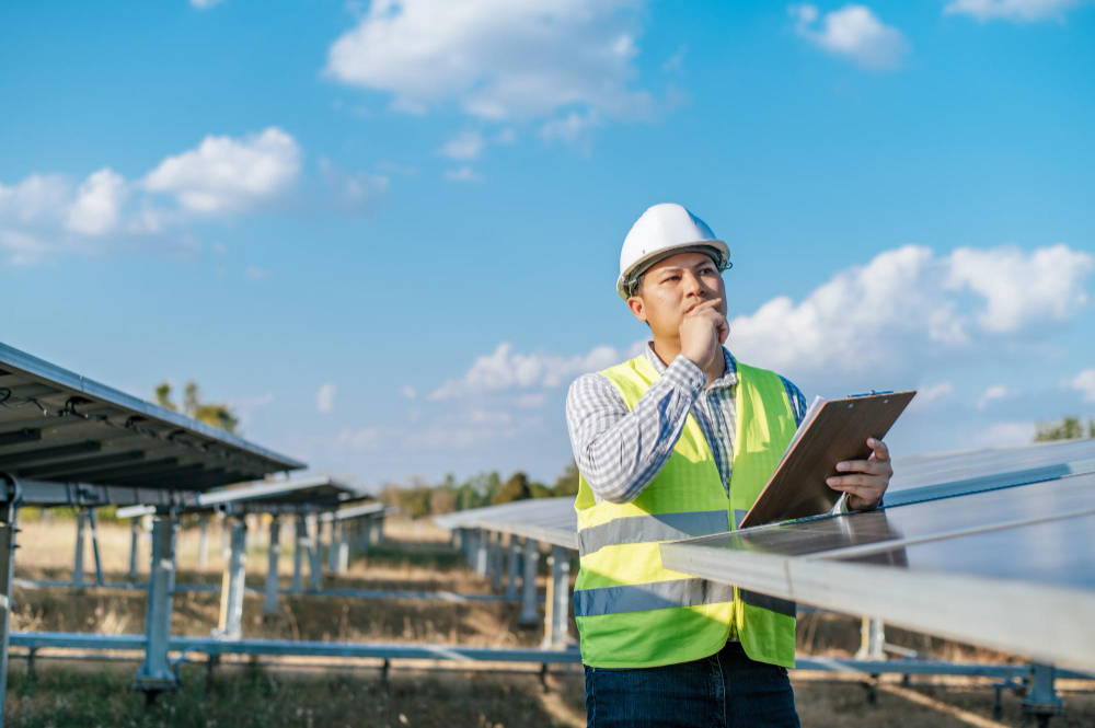 Civil engineer reviewing site plans for sustainable green building development